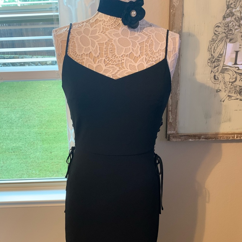 Knee length black dress, NWOT, never worn. Size 6